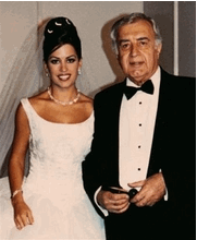 Photo Rima Akkad Monla and her father Moustapha Akkad are seen in this family photo at Rima's wedding in Beirut, Lebanon, in August, 1999. Rima, a former Los Angeles woman living in Beirut, was among dozens killed in the hotel bombings in Jordan. Her father, the executive producer of the 'Halloween' movies, was critically injured. The slain woman's mother, Patricia Akkad, told The Associated Press her daughter had just arrived in Amman for a wedding and was visiting with her father and stepmother inside a hotel lobby when a suicide bomber detonated an explosive device. Patricia Akkad says her ex-husband Moustapha Akkad suffered a heart attack as a result of the explosion and also sustained internal injuries. (AP Photo/Akkad Family)