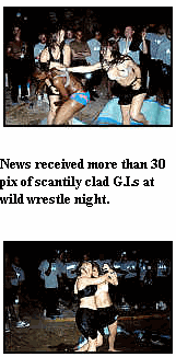 Photo: News received more than 30 pix of scantily clad G.I.s at wild wrestle night.