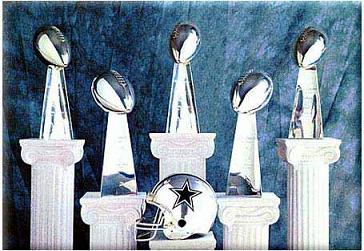 Five Lombardi Trophies from Super Bowls VI (1972), XII (1978), XXVII (1993), XXVIII (1994) and XXX (1996)