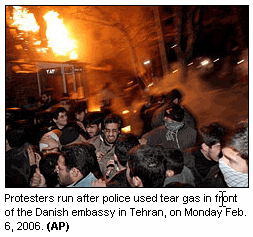 Photo: Protesters run after police used tear gas in front of the Danish embassy in Tehran, on Monday Feb. 6, 2006. (AP)