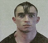 Gregory Despres is shown in this image from television. On April 25, 2005, Despres arrived at the U.S.-Canadian border crossing at Calais, Maine, carrying chain saw stained with what appeared to be blood, a homemade sword, a hatchet, a knife, and brass knuckles. U.S. customs agents confiscated the weapons, fingerprinted Despres, and then let him into the United States. Despres, the suspect in a grisly double murder in New Brunswick, Canada, was arrested in Mattapoisett, Mass., on April 27, 2005 and is being held in a jail there, charged with two counts of first-degree murder. (CP PHOTO/HO/WHDH-TV)