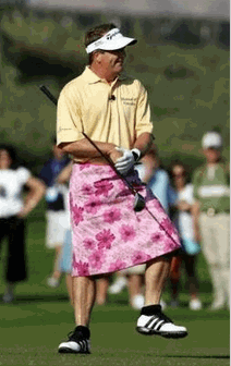 Photo Fred Funk prepares to hit his approach shot wearing a floral pink skirt, given to him by Annika Sorenstam after she outdrove him on the third hole on the first day of the Skins Game at Trilogy Golf Club in La Quinta, Calif., Saturday, Nov. 26, 2005. Funk took the lead for the day with six skins for $225,000, while Tiger Woods scored three skins for $75,000. Sorenstam and Fred Couples scored no skins. (AP Photo/Reed Saxon)