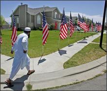 	A man comes to visit the relatives of U.S. Marine Cpl. Wassef Ali Hassoun Saturday, July 3, 2004, in West Jordan, Utah. Hassoun was beheaded in Iraq after being captured by militants. (AP Photo/Douglas C. Pizac)