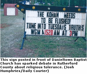 Photo: This sign posted in front of Danieltown Baptist Church has sparked debate in Rutherford County about religious tolerance.  THE KORAN NEEDS TO BE FLUSHED (Josh Humphries/Daily Courier)