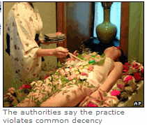 Photo: The Chinese government has banned restaurants from serving food on the bodies of naked women.
