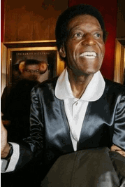 Photo Nipsey Russell poses for photographers at the New York premiere of the film 'The Aviator' Tuesday Dec. 14, 2004. Russell, who played the Tin Man alongside Diana Ross and Michael Jackson in 'The Wiz,' as part of a decades-long career in stage, television and film, Sunday afternoon Oct. 2, 2005 at Lenox Hill Hospital, said his longtime manager Joseph Rapp. (AP Photo/Tina Fineberg)