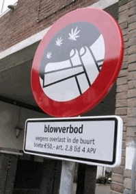 Photo A sign prohibiting the smoking of marijuana on the street is seen on the right as a man on a bicycle passes through an underpass in Amsterdam, Netherlands, Friday Feb. 3, 2006. The signs, created as part of an experimental ban on smoking marijuana in the streets of one of Amsterdam's poorer neighborhoods, are now being sold by the City of Amsterdam after being stolen as collector's items. (AP Photo/Peter Dejong)