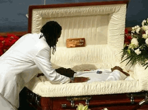 A mourner pays his respects to rapper Russell Jones, otherwise known as 'Ol' Dirty Bastard' ( O.D.B ), before his funeral November 18, 2004 in New York. Jones, a founding member of the rap group Wu-Tang Clan, collapsed and died inside a New York recording studio on Nov. 13. (Shannon Stapleton/Reuters) 