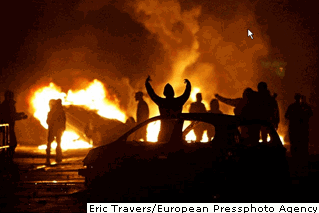 Photo A group of youths danced around a car they had set on fire in a Paris working-class district Wednesday night, the seventh night of clashes.