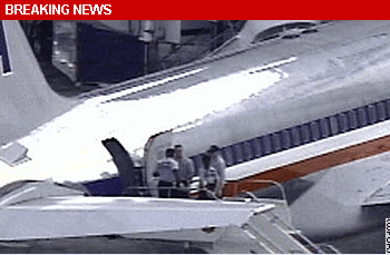 Photo: A federal air marshal shot and wounded a passenger on the Jetway connecting an American Airlines plane to Miami International Airport, sources told CNN. The marshal's action came after threatening action by the passenger, a federal government official said. The Federal Air Marshals Service confirmed a marshal fired his weapon while the Boeing 757 -- which was en route form Medellin, Colombia, to Orlando, Florida -- was on the ground at Miami.