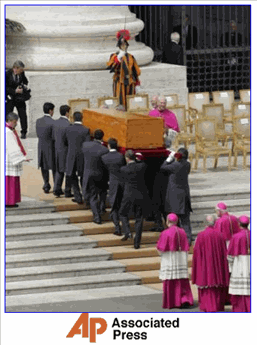 Photo: Pope John Paul II's coffin is carried away from St. Peter's Square after the funeral service on its way to the grottos beneath St. Peter's Basilica, at the Vatican, Friday, April 8, 2005. The grottos form a cramped underground cemetery beneath St. Peter's Basilica where pontiffs throughout the ages, royals and even an emperor have been laid to rest. (AP Photo/Diether Endlicher) 