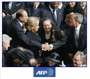 Photo: French President Jacques Chirac (L) shakes and with US President George W. Bush before the funeral of Pope John Paul II in St Peter's Square at the Vatican City. The pope's funeral mass drew a veritable United Nations of world leaders, from Afghan President Hamid Karzai to President Vicente Fox of Mexico.(AFP/Vincenzo Pinto)