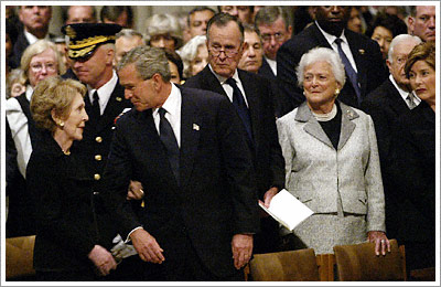 President Bush escorts Nancy Reagan in the Cathedral. (WaPo- AFP)