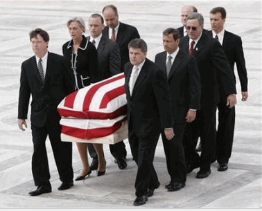 Photo: The casket of U.S. Supreme Court Chief Justice William Rehnquist is carried into the Supreme Court building in Washington by his former court law clerks, including Judge John Roberts (second from front on right), the man nominated by President Bush to replace Rehnquist as Chief Justice, September 6, 2005. Rehnquist's body will lie in state in the Court until his September 7 funeral. (Kevin Lamarque/Reuters)