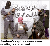 Photo: Italian hostage Salvatore Santoro's captors were seen reading a statement