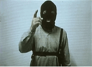 Photo A video grab released on November 16, 2005 shows a militant believed to be Malaysian Noordin M. Top, a senior operative of Jemaah Islamiah, a Southeast Asian group seen as the regional arm of al Qaeda. The masked man warned Western countries, especially Australia, of more attacks in a video found last week by Indonesian anti-terrorist police. The video also showed three young suicide bombers who killed 20 people in attacks on restaurants on the resort island of Bali on October 1, 2005. (SCTV via Reuters TV/Reuters)