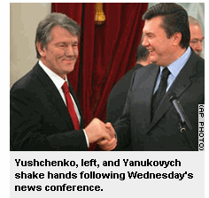 Yushchenko, left, and Yanukovych shake hands following Wednesday's news conference.