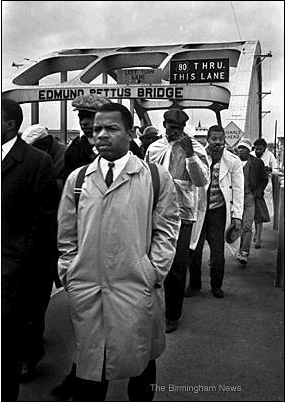 Photo: March 7, 1965: John Lewis, center, leads marchers with fellow activist Hosea Williams across Selma's Edmund Pettus Bridge hoping to march to the capitol in Montgomery. Troopers and deputies used tear gas and clubs to stop the march moments later.