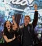 Finalists Katharine McPhee, left, and Taylor Hicks, celebrate after they each were given a new car during the season finale of American Idol on Wednesday, May 24, 2006 in Los Angeles. (AP Photo/Kevork Djansezian)