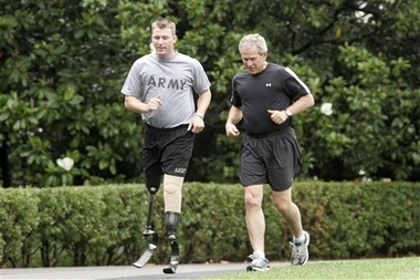 President Bush runs with SSG Christian Bagge wounded Iraq vet President Bush jogs with Army Staff Sgt. Christian Bagge, 23, from Eugene, Ore., who lost both legs to a roadside bomb in Iraq, on the South Lawn of the White House in Washington Tuesday, June 27, 2006. (AP Photo/Gerald Herbert)