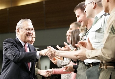 Photo Rumsfeld Pays Farewell Visit to Troops in Iraq Outgoing Defense Secretary Donald H. Rumsfeld, left, accompanied by Joint Chiefs Chairman, Gen. Peter Pace, shakes hands with Pentagon personnel before his speech at a town hall meeting at the Pentagon, Friday, Dec. 8, 2006. (AP Photo/Haraz N. Ghanbari)