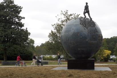 Spaceship Earth Sculpture Photo BEFORE: A life-size figure of the late environmentalist David Brower stands atop a massive sphere in 'Spaceship Earth,' the $1 million sculpture unveiled at Kennesaw State University in October.