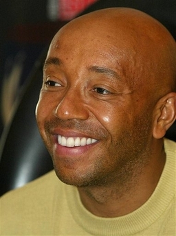 Russell Simmons Photo Russell Simmons smiles in his office in New York, in this file photo from April 16, 2002. Hip-hop mogul Russell Simmons said Monday that the recording and broadcast industries should consistently ban three racial and sexist epithets from all so-called clean versions of rap songs and the airwaves.(AP Photo/Shawn Baldwin,file)