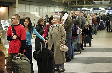 Airport Delays Photo Passengers on a busy travel day wait on line at Chicago's O'Hare Airport
Scott Olson / Getty