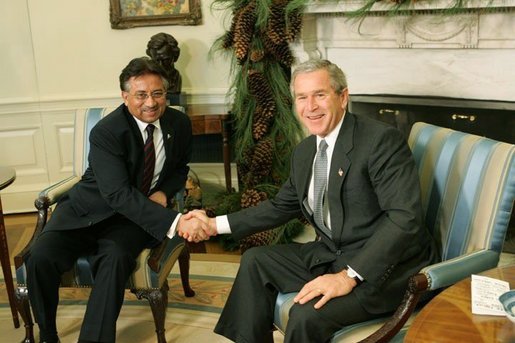 Bush and Musharraf Photo  President George W. Bush and Pakistan President Pervez Musharraf pose during a photo-op in the Oval Office Saturday, Dec. 4, 2004.White House photo by Tina Hager