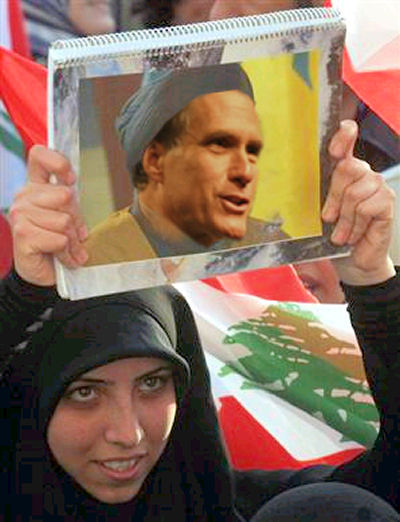 Muslim Woman Holding Mitt Romney Picture