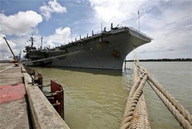 USS Kitty Hawk Photo The USS Kitty Hawk carrier is anchored at Malaysia