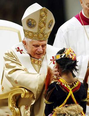 Pope: Science Not Dogma Pope Benedict XVI blesses a child as he celebrates the Christmas Midnight Mass in St. Peter