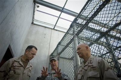 Joint Chiefs Chairman: Close Guantanamo In this photo released by the Department of Defense, Col. Bruce Vargo, center, joint detention group commander, gives a tour of a detainee recreation area at Camp Six, Joint Task Force Guantanamo, Cuba, to Chairman of the Joint Chiefs of Staff, Navy Adm. Mike Mullen and Rear Adm. Mark Buzby, commander, Joint Task Force Guantanamo, Sunday Jan. 13, 2008. Mullen said Sunday he favors closing the prison as soon as possible because he believes negative publicity worldwide about treatment of terrorist suspects has been 
