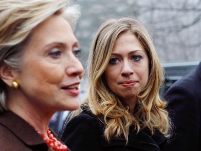Did Chelsea Clinton Break the Law? Democratic presidential hopeful US Sen. Hillary Clinton (L) (D-NY) talks to reporters as her daughter Chelsea (C) and her husband former US President Bill Clinton (R) look on at the Douglas Grafflin Elementary School polling place February 5, 2008 in Chappaqua, New York. Voters will go to the polls in 22 states for the Super Tuesday presidential primary election. (Justin Sullivan/Getty)