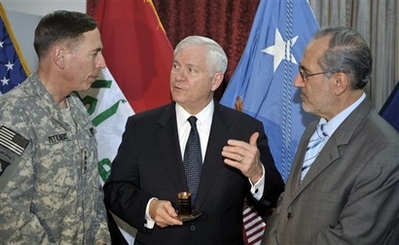 Bob Gates with David Petraeus Photo In this photo provided by the Department of Defense, U.S. Army Gen. David Petraeus, Commanding General Multi National Force Iraq, Secretary of Defense Robert M. Gates and Iraqi National Security Advisor Dr. Al Rubai'e discuss Iraqi defense issues during an unannounced visit by Secretary Gates after he left the 44th Munich Security Conference, Sunday, Feb. 10, 2008, in Baghdad, Iraq.
(AP Photo/Department of Defense, Tech. Sgt. Jerry Morrison)