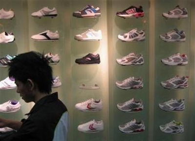 Sneakers the Sign of a Leader? A sneaker store in China's southern city of Guangzhou February 17, 2008. A recent poll has found that people who buy three pairs of sneakers or more a year are far more likely to be a leadership type that other people. (Joseph Chaney/Reuters)