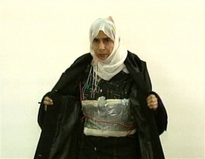 Al Qaeda Unfair to Women! In this file image made from television on Nov. 13, 2005, Iraqi Sajida al-Rishawi opens her jacket and shows an explosive belt as she confesses on Jordanian state-run television to her failed bid to set off an explosives belt inside one of the three Amman hotels targeted by al-Qaida. Women Muslim extremists have posted Internet messages in recent weeks expressing frustration with the al-Qaida No. 2 leader's refusal to give them a larger role in terror attacks - an extraordinary, emotional debate that offers rare insight into the tense gender politics lurking below the surface of al-Qaida's severe strain of Islam.
(AP Photo/Jordanian TV, File)