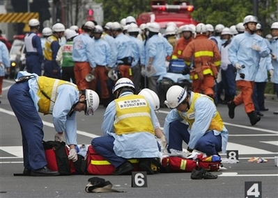 Tokyo Stabbing Spree Photo Rescue workers from Tokyo Fire Department get ready with their equipment after their arrival in Tokyo's Akihabara district Sunday afternoon, June 8, 2008. A reported gangster went on a midday stabbing rampage in Tokyo's premier electronics and video game district Sunday, knifing at least 14 people. A news report said at least two of the victims were dead.<br /> (AP Photo/Itsuo Inouye)