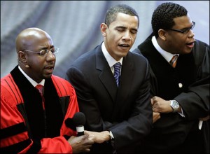 Barack Obama links arms with Rev. Raphael Warnock, left, and associate pastor Shanan Jones as they sing \"We Shall Overcome\" during a church service at Ebenezer Baptist Church. (AP).