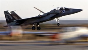 In this Thursday, Dec. 27, 2007 photo, an Israeli Air Force fighter plane lands during an acrobatics display at a graduation ceremony at the Hatzerim Air Force Base near the southern Israeli city of Beersheba. Israel appears increasingly confident that it would be able to deal a sharp setback to Iran's nuclear program, if not destroy it, through a military strike. (AP Photo/Kevin Frayer, File)