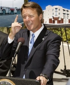 In this July 21, 2008 file photo, former North Carolina Sen. John Edwards gestures during a news conference Los Angeles. Edwards is admitting to an extramarital affair but denies fathering the woman's daughter. (AP Photo/Damian Dovarganes, File)