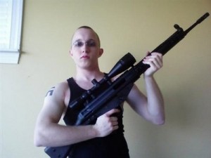 This undated photo obtained from a MySpace webpage shows Daniel Cowart, 20 of Bells, Tenn. holding a weapon. Federal agents have broken up a plot to assassinate Democratic presidential candidate Sen. Barack Obama, D-Ill. and shoot or decapitate 102 black people in a Tennessee murder spree, the ATF said Monday Oct. 27, 2008. In court records unsealed Monday, federal agents said they disrupted plans to rob a gun store and target a predominantly African-American high school by two neo-Nazi skinheads. The men, Daniel Cowart, 20, of Bells, Tenn., and Paul Schlesselman 18, of West Helena, Ark., are being held without bond. (AP Photo) 