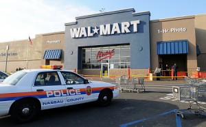 Police tape surrounds a Wal-Mart that was the scene of a deadly stampede. (NY Daily News)
