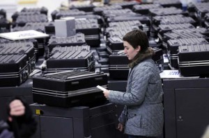 A recount worker searchs for the ten correct ballot boxes on her list, which were then opened up and looked into for uncounted ballots at the Minneapolis recount site on Wednesday, Dec. 3, 2008. (Pioneer Press: Scott Takushi)