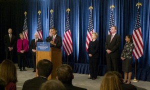 President-elect Barack Obama takes questions from reporters during a news conference in Chicago, Monday, Dec. 1, 2008, with, from left to right: Attorney General-designate Eric Holder; Homeland Security Secretary-designate Janet Napolitano; Defense Secretary Robert Gates; Vice President-elect Joe Biden; Secretary of State-designate Sen. Hillary Rodham Clinton, D-N.Y.; National Security Adviser-designate Ret. Marine Gen. James Jones; and United Nations Ambassador-designate Susan Rice. 
