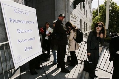 People wait in line for a decision from the California State Supreme Court on the legality of a voter-approved ban on same-sex unions, Tuesday, May 26, 2009, in San Francisco. (AP Photo/Paul Sakuma)