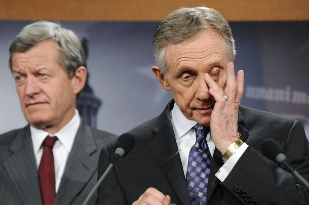 Senate Majority Leader Harry Reid (D-NV) (R) wipes his eyes as he and Senator Max Baucus (D-MT) (L) address senate health care legislation at the US Capitol in Washington December 19, 2009. U.S. Senate Democrats reached a compromise on Saturday with holdout Senator Ben Nelson that secured the 60 votes they need to pass the broad healthcare overhaul sought by President Barack Obama. (Reuters Pictures)