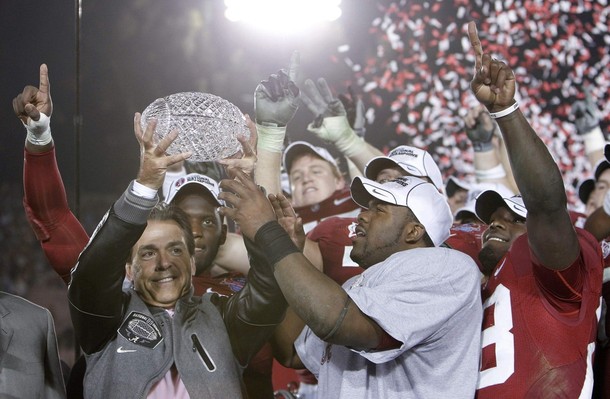 Head coach Nick Saban (L) of the Alabama Crimson Tide and Heisman trophy winner Mark Ingram (R) hold the championship trophy after their team defeated the Texas Longhorns in the NCAA's BCS National Championship football game in Pasadena, January 7, 2010.  (Reuters Pictures)