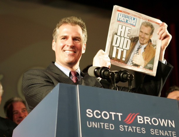 Republican U.S. Senator-elect Scott Brown holds up a copy of the Boston Herald announcing his victory over Democrat Martha Coakley in Boston, Massachusetts January 19, 2010.   REUTERS/Adam Hunger   (UNITED STATES - Tags: POLITICS ELECTIONS)